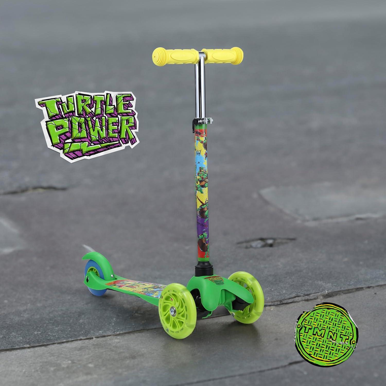 imageSelf Balancing Kick Scooter with Light Up Wheels Extra Wide Deck 3 Wheel Platform Foot Activated Brake 75 lbs Limit Kids amp Toddlers Girls or Boys for Ages 3 and UpTMNT