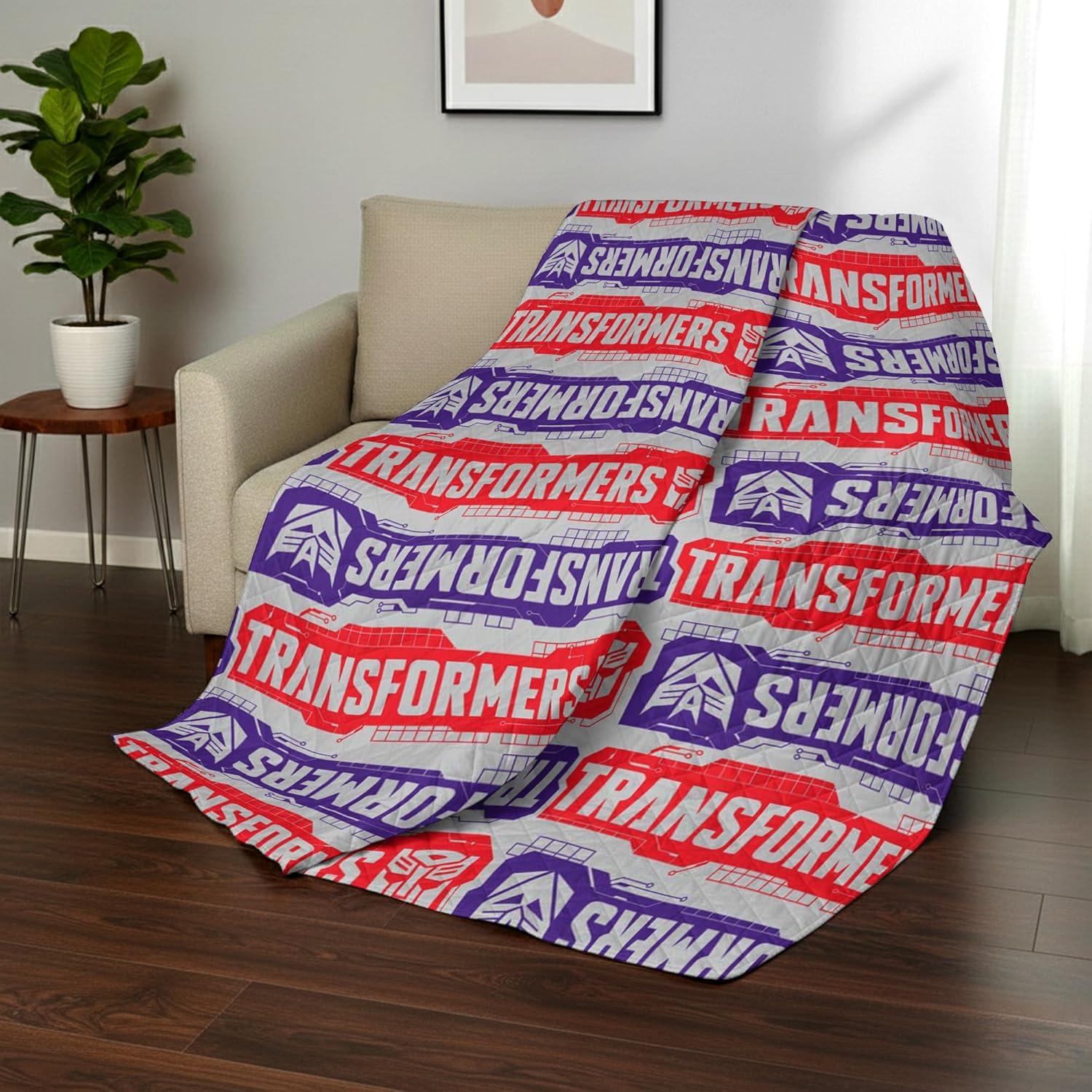 imageNorthwest Bluey Goofing Around Quilted Throw Blanket Official Cartoon Throw Blanket Featuring Bluey for Adults Boys Girls Bed Couch or Playroom 60 x 80 InchesTransformer Logo