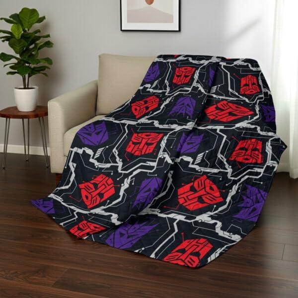 imageNorthwest Bluey Goofing Around Quilted Throw Blanket Official Cartoon Throw Blanket Featuring Bluey for Adults Boys Girls Bed Couch or Playroom 60 x 80 InchesTransformer Logo