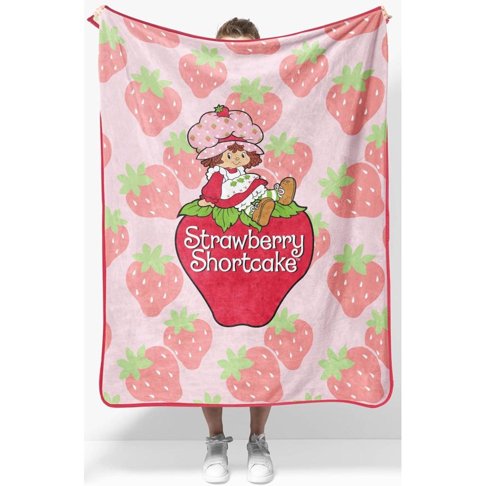 imageJay Franco Kids Plush Throw Blanket  Soft amp Comfy Throw for Couch or Bed  Cozy Home Dcor for Living Room amp Bedroom Blue  Bluey 40x50  Travel BlanketPink  Strawberry Shortcake