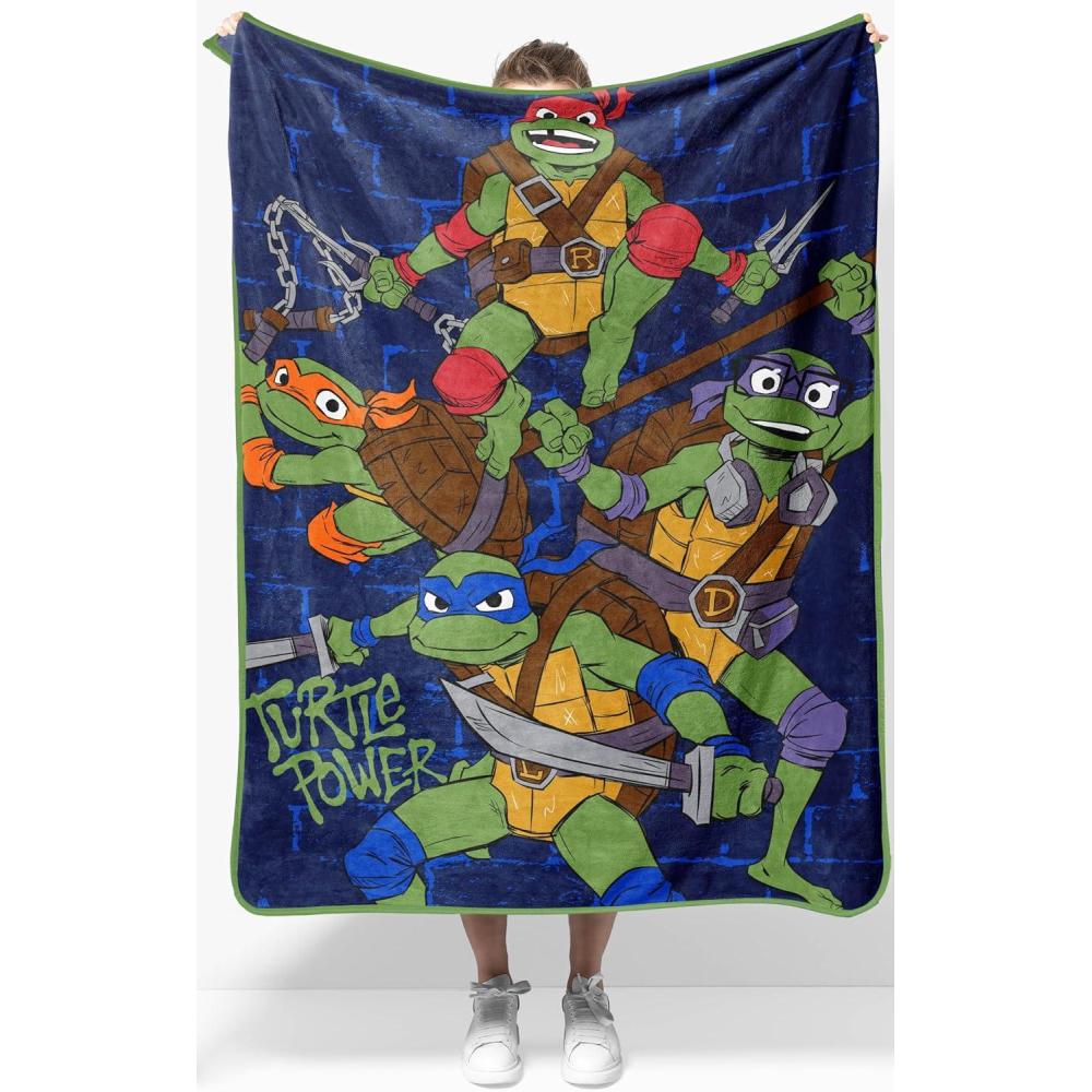 imageJay Franco Kids Plush Throw Blanket  Soft amp Comfy Throw for Couch or Bed  Cozy Home Dcor for Living Room amp Bedroom Blue  Bluey 40x50  Travel BlanketBlue  Teenage Mutant Ninja Turtles