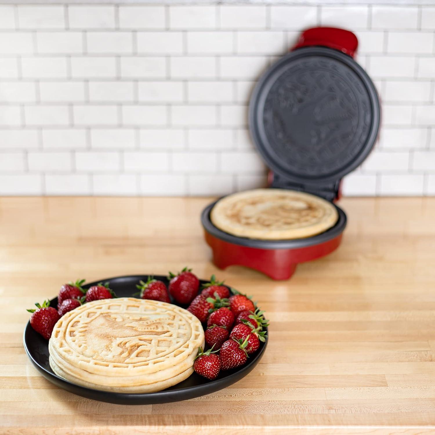 imageUncanny Brands Bluey Waffle Maker NonStick Round Waffle Iron Easy to Use and CleanJurassic Park