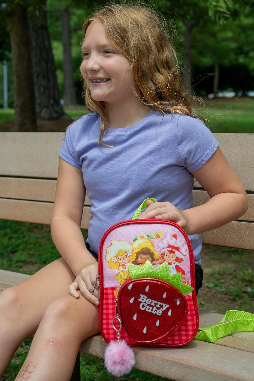 imageAI ACCESSORY INNOVATIONS Bluey 9 Micro Mini Backpack Purse Featuring a 3D Bluey Glitter Patch with Pom Pom Dangle BlueStrawberry Shortcake